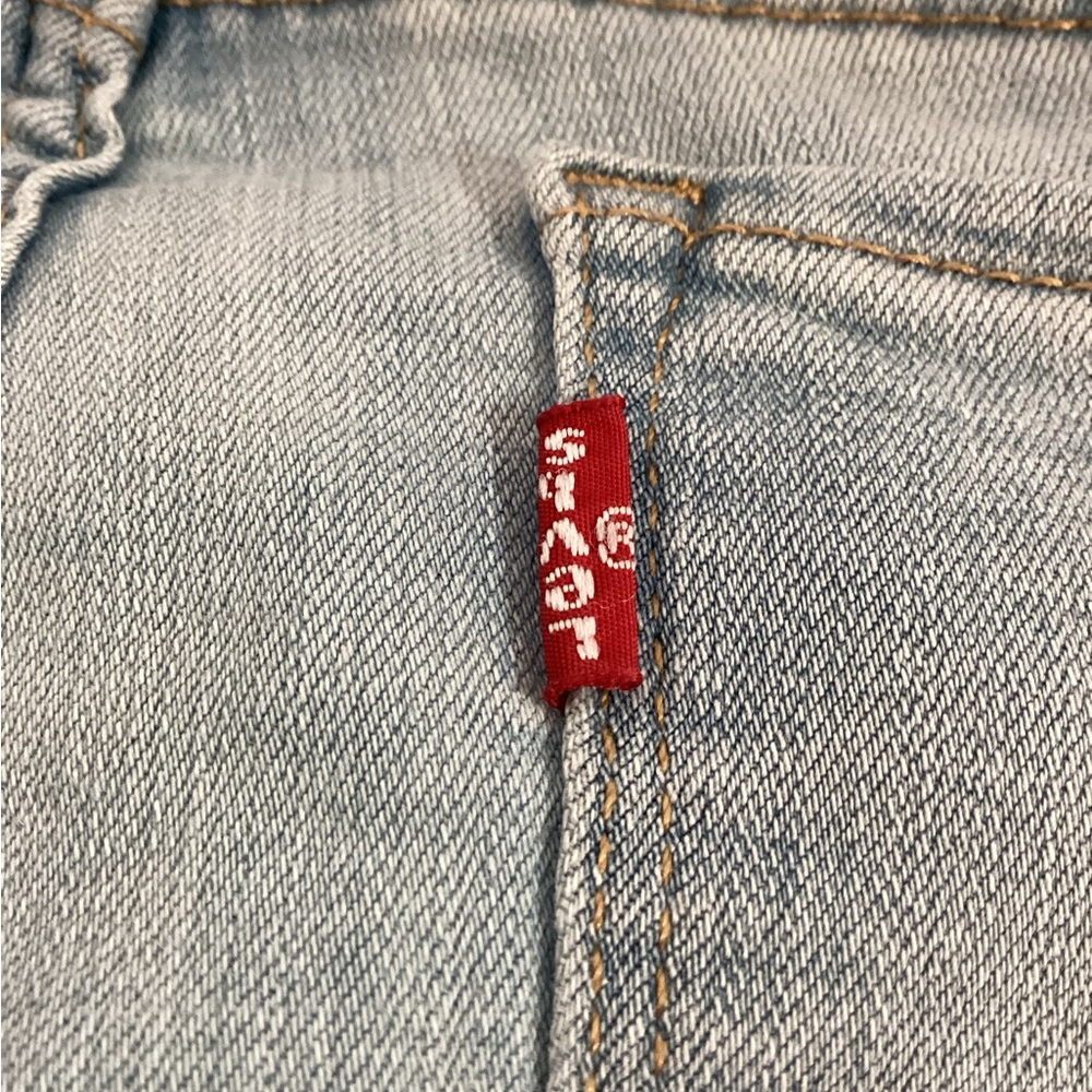 Levi's ,Light Wash Denim Jeans with Red Tag Upside Down, 710 Super Skinny